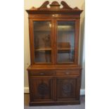 Late Victorian Stained Wood Bookcase on Cupboard Base, Having two Glazed Doors above two small