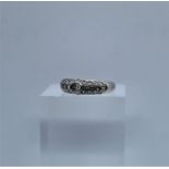 Ladies Diamond Ring, Set with small Diamonds, On an unmarked White Gold shank, Hallmarks for London,