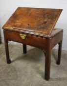 George III Mahogany Architects Desk, Having a moulded top above a frieze Drawer and enclosed Writing