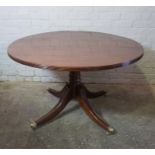 Modern Mahogany Pedestal Table, Having a Circular top, Raised on Quadrapartite supports with Brass