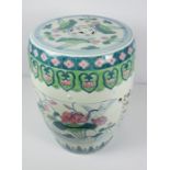 Chinese style Pottery Barrel Seat / Stand, Decorated with Floral panels on a white ground, 46cm