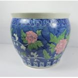 Chinese style Pottery Jardiniere, Decorated with Floral panels on a blue ground, 35cm high, 41cm