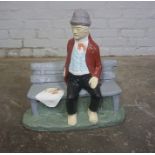 Painted Composite Stone Garden Figure, Modelled as a Man Sitting on a Bench, 17cm high