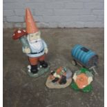 Four Painted Garden Ornaments, Modelled as a Knome, Mask, Gypsy Carriage and a Male, (4)
