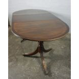 Regency style Mahogany Twin Pedestal Dining Table, With an additional leave, Raised on ring turned