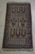 Afghan Hand Knotted Rug, Decorated with Geometric palaces and motifs on a red ground, 146cm x 80cm