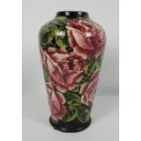 Wemyss style Vase, Decorated will allover panels of pink roses with green stems on a black ground,