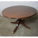 Modern Mahogany Pedestal Table, Having a circular top, Raised on quadrapartite supports with brass