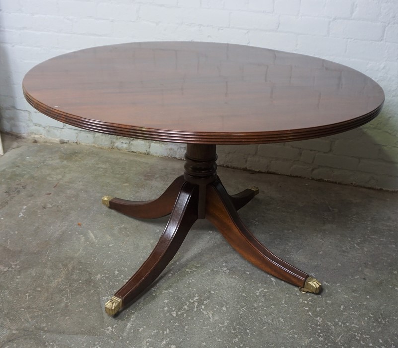 Modern Mahogany Pedestal Table, Having a circular top, Raised on quadrapartite supports with brass - Image 2 of 3