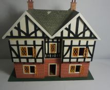 Painted Dolls House, 68cm high, 73cm wide, 35cm deep