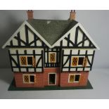 Painted Dolls House, 68cm high, 73cm wide, 35cm deep