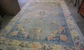 Chinese Carpet, Decorated with Floral panels on a blue ground, 385cm x 273cm