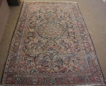 Persian Hand Knotted Rug, Decorated with allover Floral panels on a red, white and blue ground,