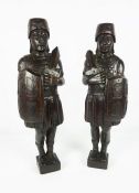 Pair of Carved Oak Surmount / Finials, Modelled as Roman Soldiers, 50cm high (2)