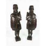 Pair of Carved Oak Surmount / Finials, Modelled as Roman Soldiers, 50cm high (2)