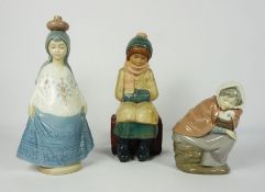 Nadal Glazed Pottery Figure, Modelled as a girl wearing a hat and scarve, With two Nao Figures of