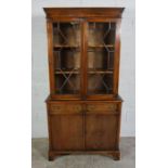 Mahogany Bookcase on Chest, Having two glazed astragal doors enclosing a shelved interior, Above two