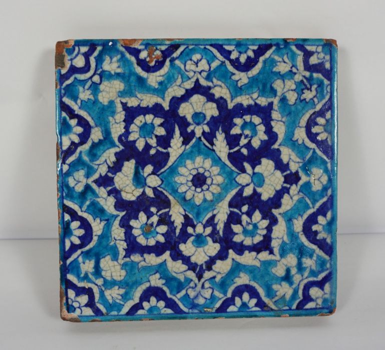 Persian style Terracotta Tile, Having floral decoration on a blue ground, 23cm