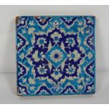 Persian style Terracotta Tile, Having floral decoration on a blue ground, 23cm