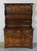 Oak Dresser, Having open shelving above three small drawers and three cupboard doors, 183cm high,