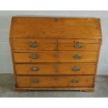 Pitch Pine Writing Bureau, circa 19th century, Having a fall front above two small drawers and three