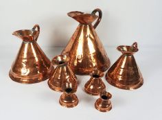 Set of Seven Copper Graduated Measuring Jugs, circa 19th century, Largest one gallon (7)Condition