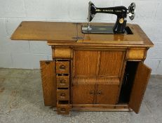 Singer Oak Cased Table Sewing Machine, 75cm high , 81.5cm wide, 44cm deep