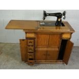 Singer Oak Cased Table Sewing Machine, 75cm high , 81.5cm wide, 44cm deep