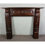 Carved Mahogany Fire Surround, In Victorian style with leaf to centre and repeating Dragon carving