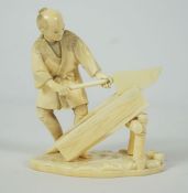 Japanese Ivory Okimono, Meiji Period, Modelled as a Carpenter, Red seal mark to the underside,