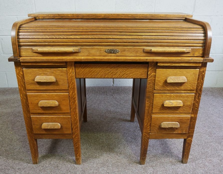 Oak Roll Top Desk, Circa Early 20th Century, Having a tambour roller shutter, Above a drawer,