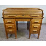 Oak Roll Top Desk, Circa Early 20th Century, Having a tambour roller shutter, Above a drawer,