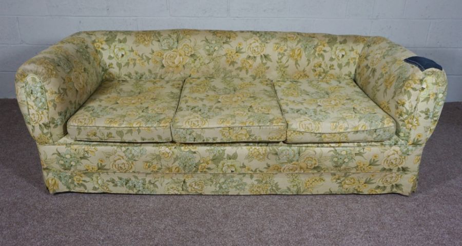 Floral 3 seater Chesterfield sofa with denim patchwork to the right arm.