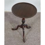 Mahogany Wine Table, In George III style, the circular top on leaf carved tripod base