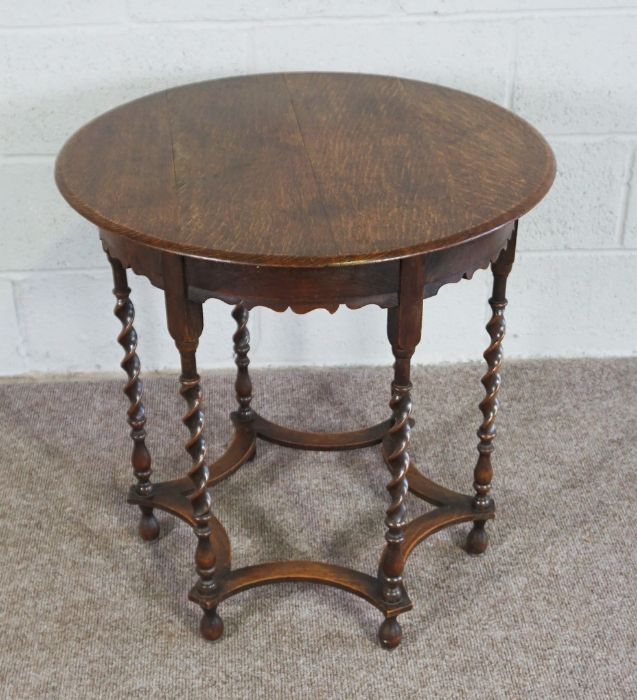 An oak occasional table, Circular top on Barley Twist legs