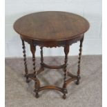 An oak occasional table, Circular top on Barley Twist legs