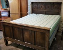Charles II Style Oak Bed, Decorated with roundels, Raised on metal castors, With side rails, Later