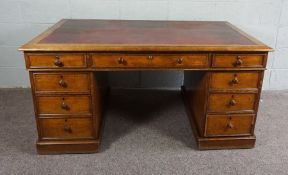 A Victorian Mahogany Partners Desk, Rectangular top over three shallow frieze drawers above an