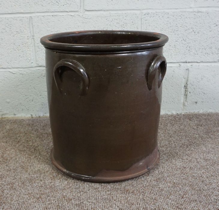 A Brown Glazed Earthenware Pot of cylindrical form with loop handles