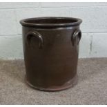 A Brown Glazed Earthenware Pot of cylindrical form with loop handles