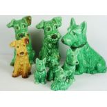 Seven Various Sylvac Green Glazed Dogs and a similar brown glazed example (7)