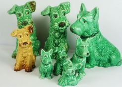 Seven Various Sylvac Green Glazed Dogs and a similar brown glazed example (7)
