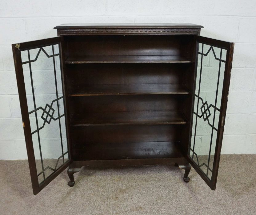 A George III style glazed stained pine bookcase, 20th century, with two doors enclosing shelves, - Image 2 of 3