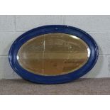 Three assorted modern wall mirrors, including a painted oval mirror, and a silvered rectangular