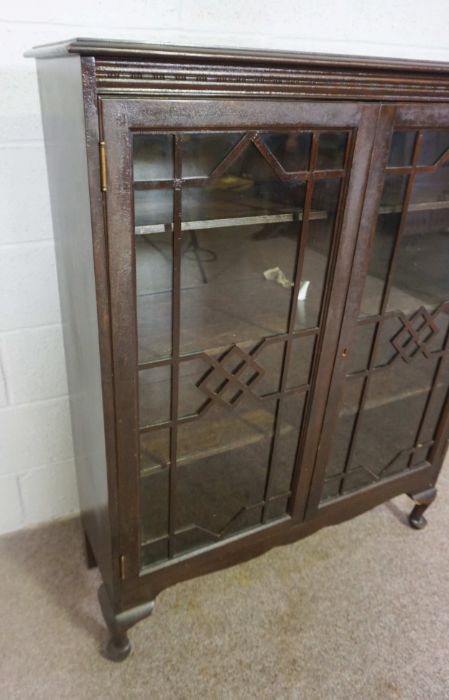 A George III style glazed stained pine bookcase, 20th century, with two doors enclosing shelves, - Image 3 of 3