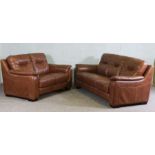 Pair of leather sofas, modern, upholstered in tan, one thee seater, 207cm wide, the other two
