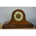 Walnut Cased Mantle Clock on domed form with ball feet
