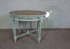 A painted Edwardian style Colonial style occasional table, with later glass top, the circular top