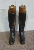 A pair of leather riding boots, including a pair of fitted vintage boot trees, labelled 'Jackson...