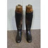 A pair of leather riding boots, including a pair of fitted vintage boot trees, labelled 'Jackson...